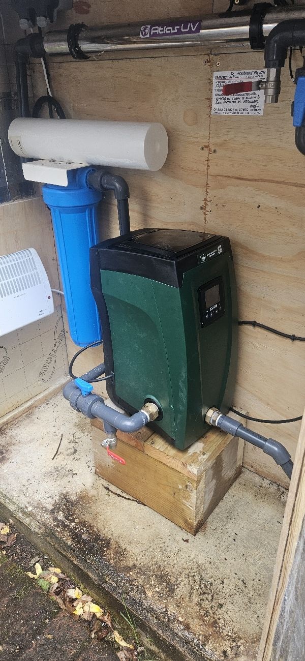 Installed DAB E.sybox connected to the property's water pipework near Farnham