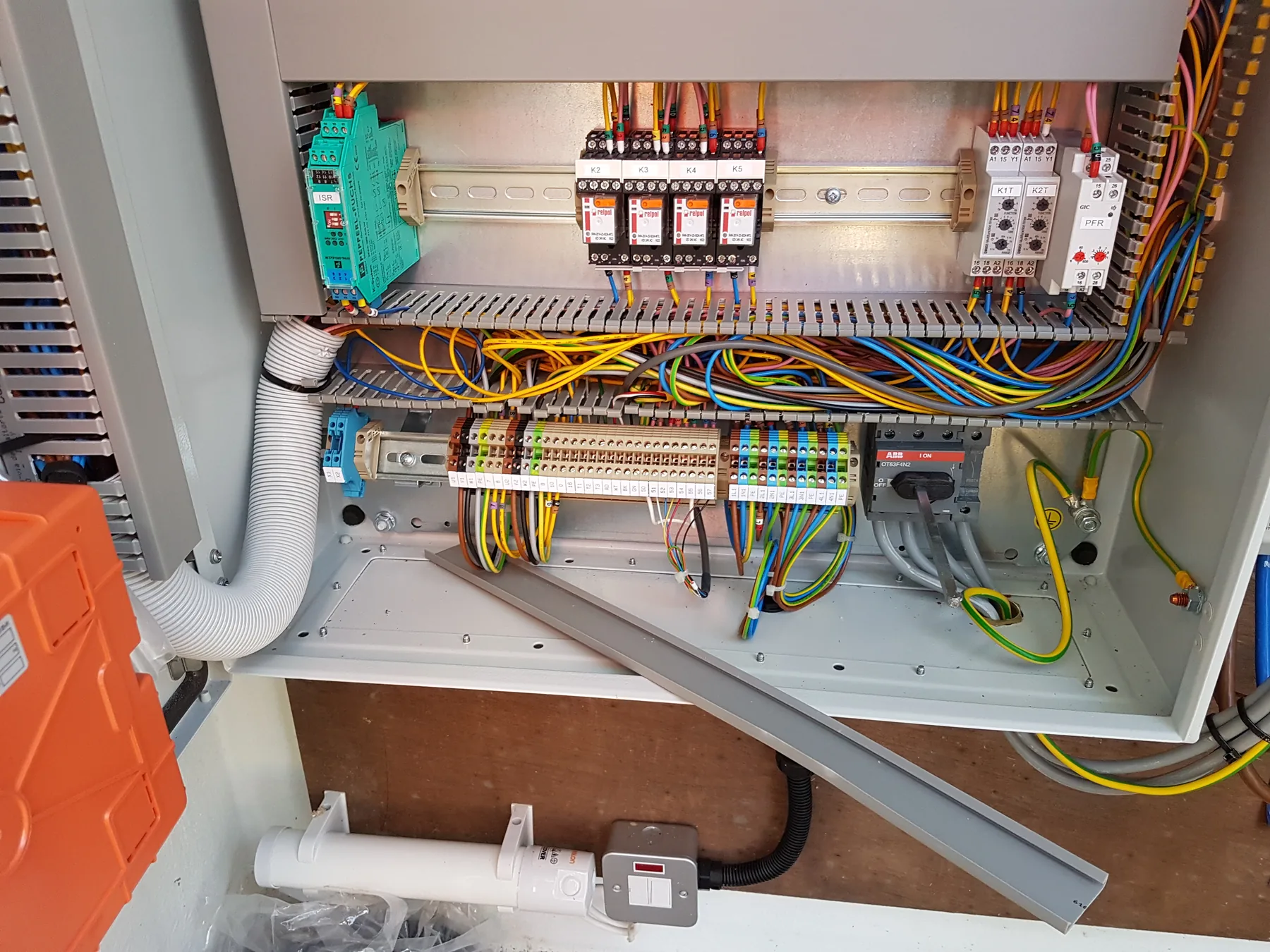 Internal wiring and protection components inside the pump control panel