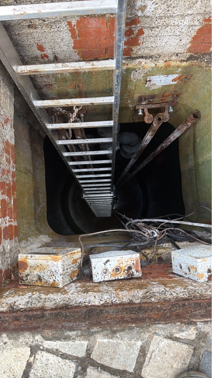 London pump station chamber following guide rail and lifting-chain repair