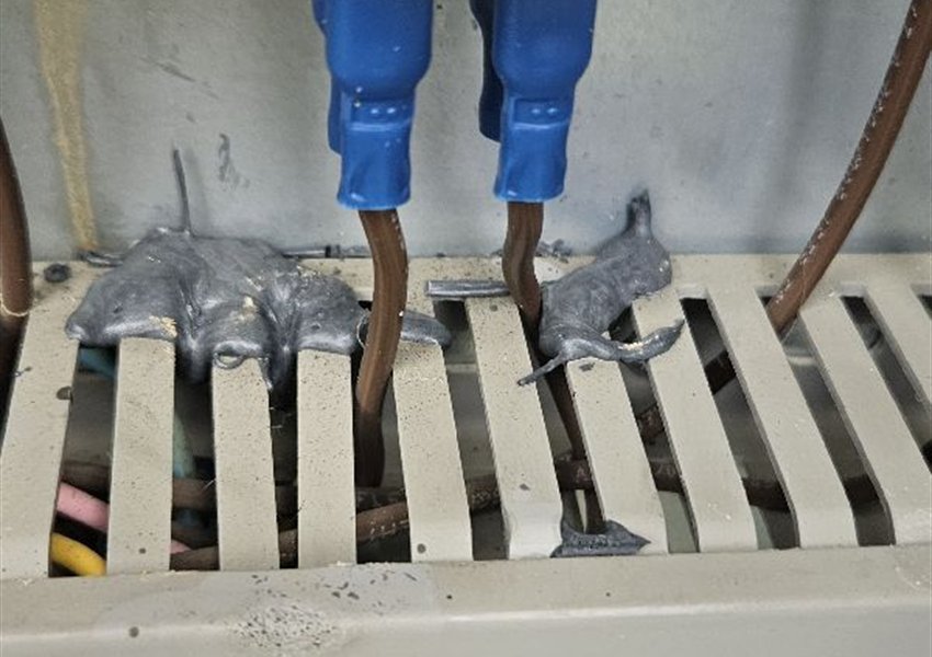 Marks on a rail inside a pump control panel