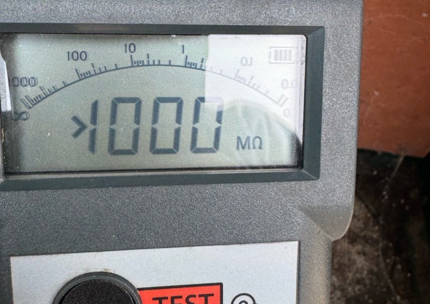 Insulation test meter showing a reading above 1000 megohms