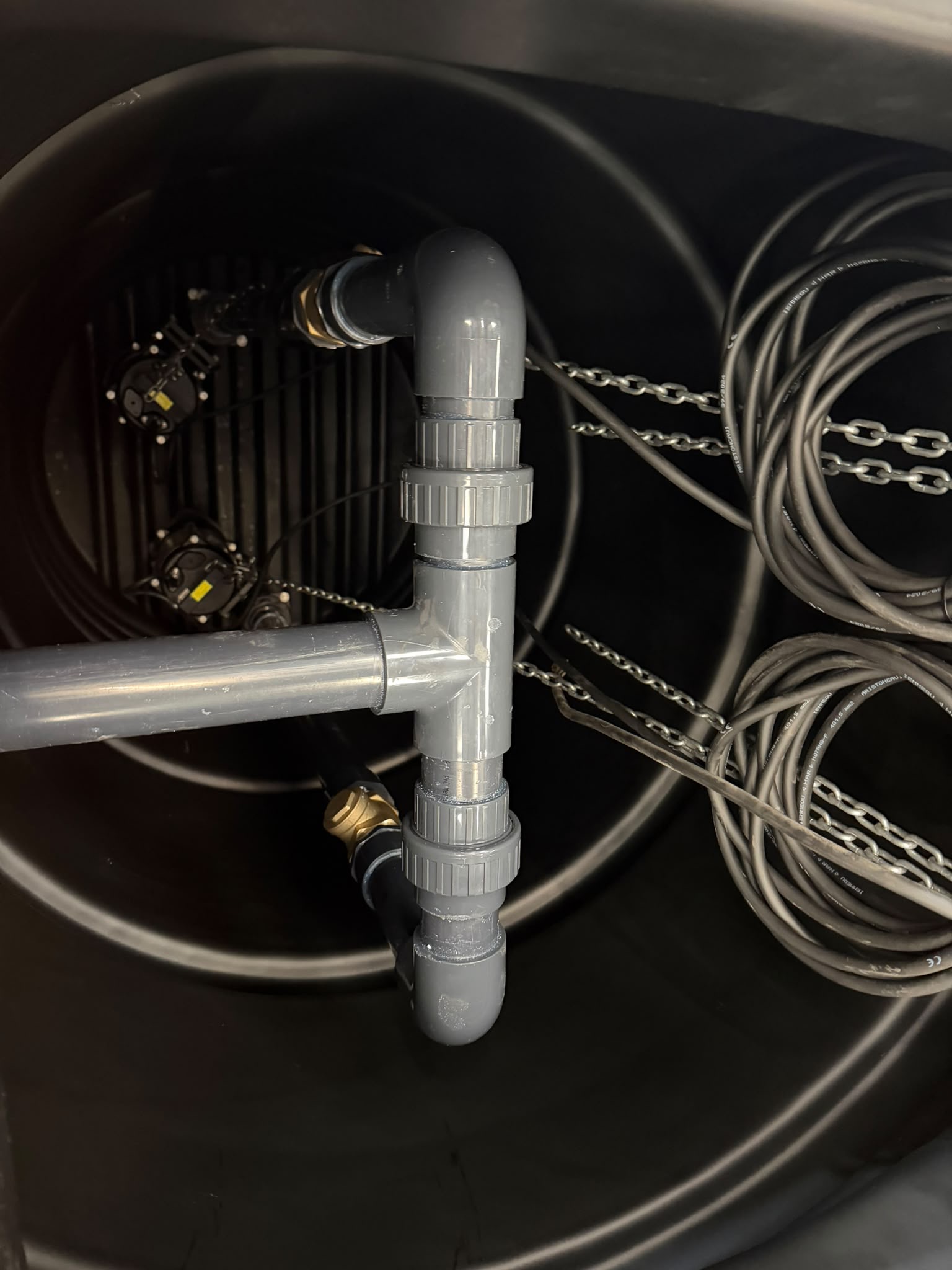 Submersible pumps and floats inside a pump chamber
