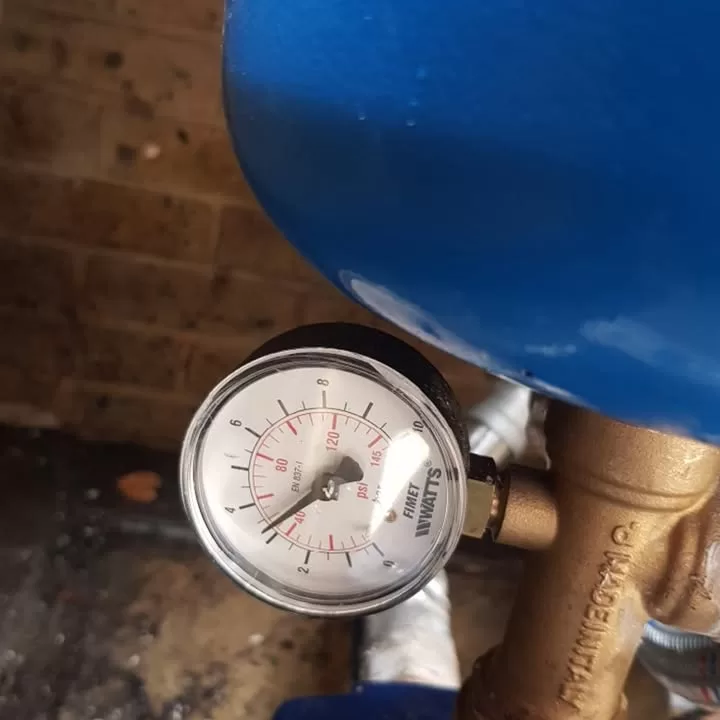 Pressure gauge on the booster pump system showing pressure reading